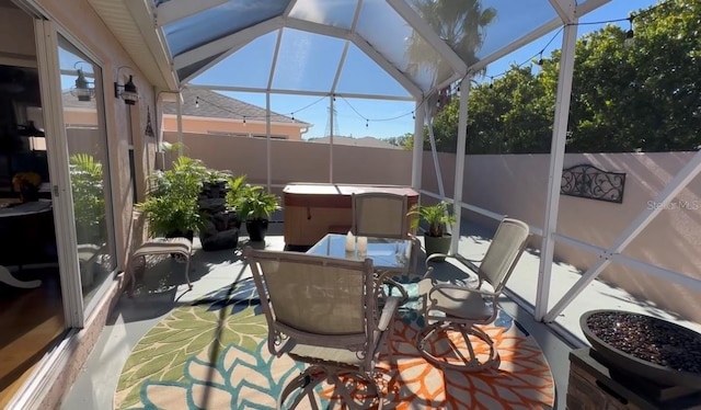 sunroom / solarium featuring plenty of natural light and vaulted ceiling