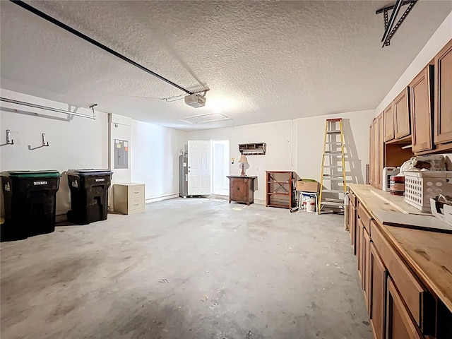 garage with electric panel and a garage door opener