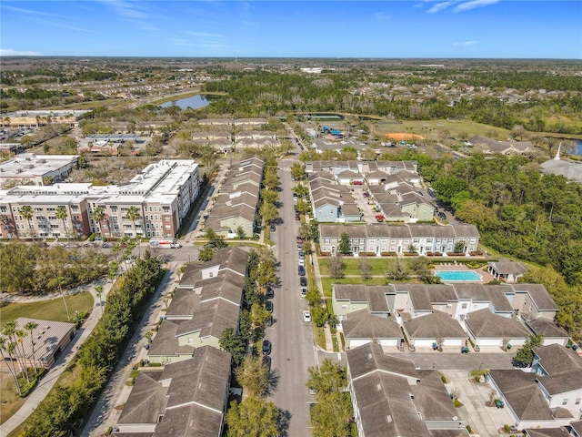 bird's eye view featuring a residential view and a water view