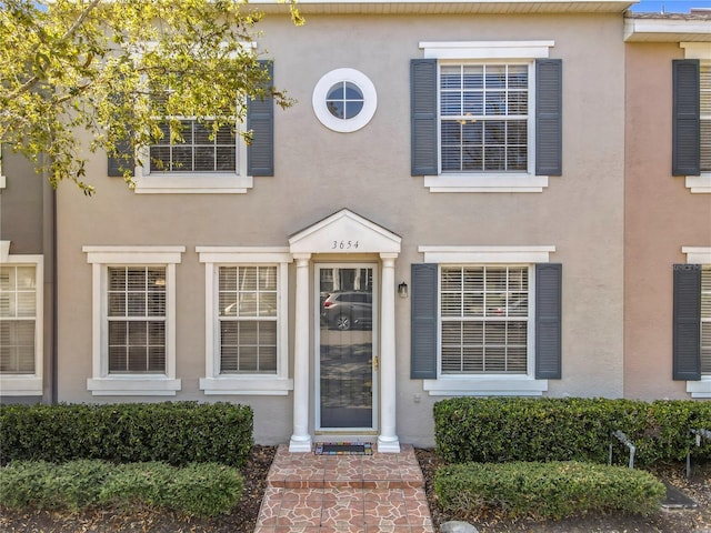 exterior space featuring stucco siding