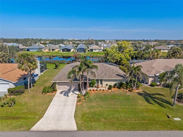 aerial view featuring a water view and a residential view