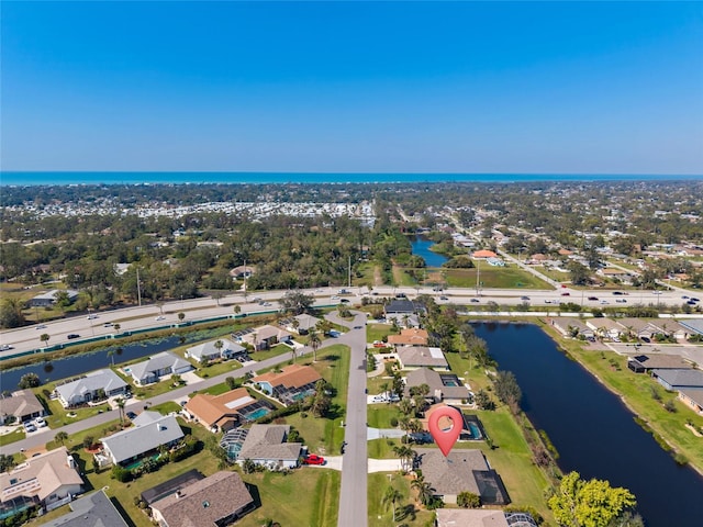 aerial view featuring a water view and a residential view