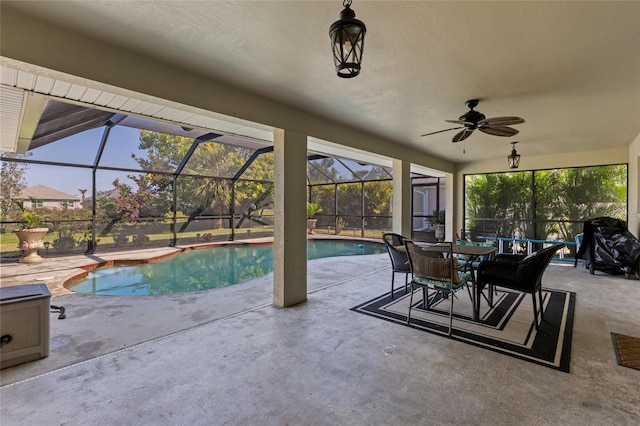 outdoor pool with glass enclosure, outdoor dining area, a ceiling fan, and a patio