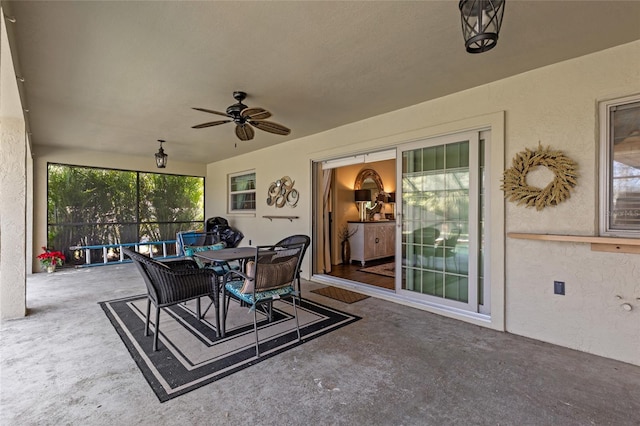 view of patio / terrace with ceiling fan and outdoor dining space