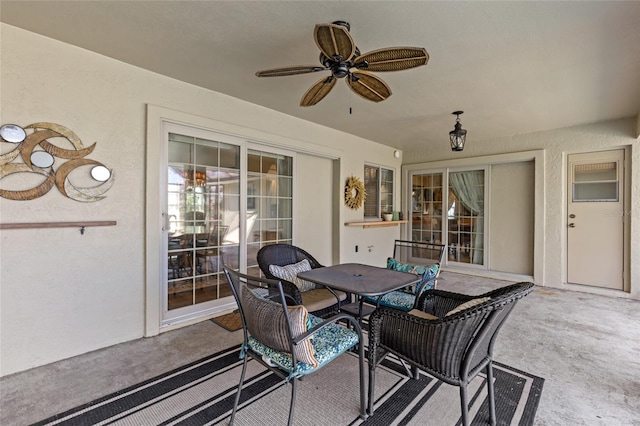 view of patio featuring a ceiling fan and outdoor dining space