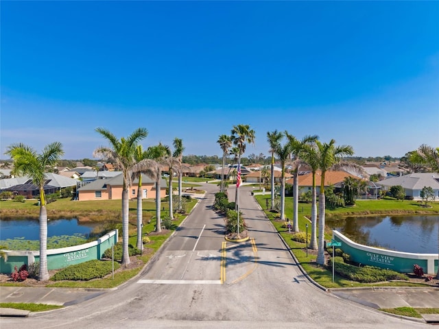 view of property's community with a residential view and a water view