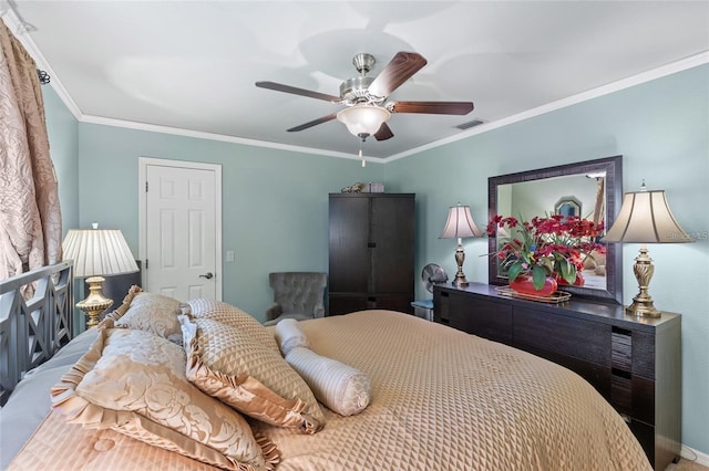 bedroom featuring visible vents, ornamental molding, and ceiling fan