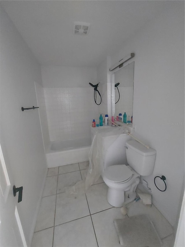 full bathroom featuring visible vents, baseboards, toilet,  shower combination, and tile patterned flooring