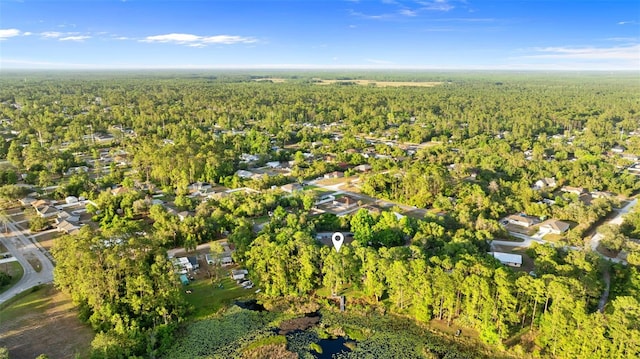 aerial view with a wooded view and a residential view