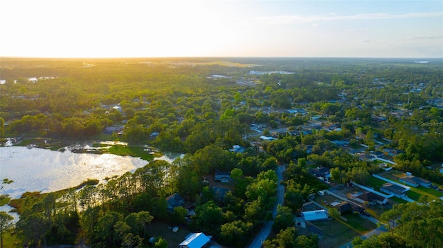 drone / aerial view featuring a wooded view