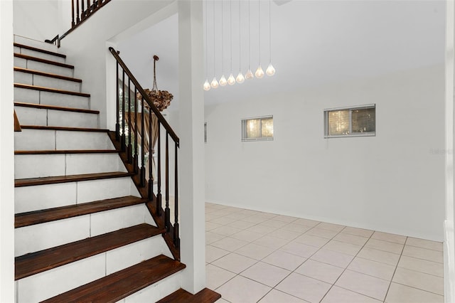 stairway with a towering ceiling