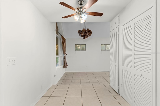 corridor with light tile patterned floors