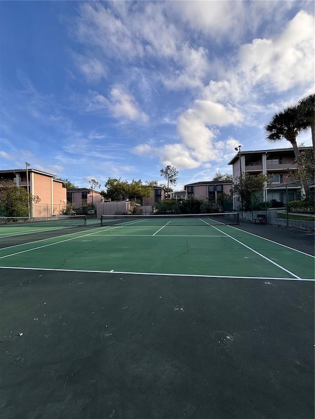 view of sport court with fence