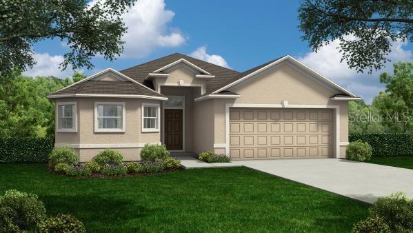 ranch-style house featuring a garage, concrete driveway, a front lawn, and stucco siding