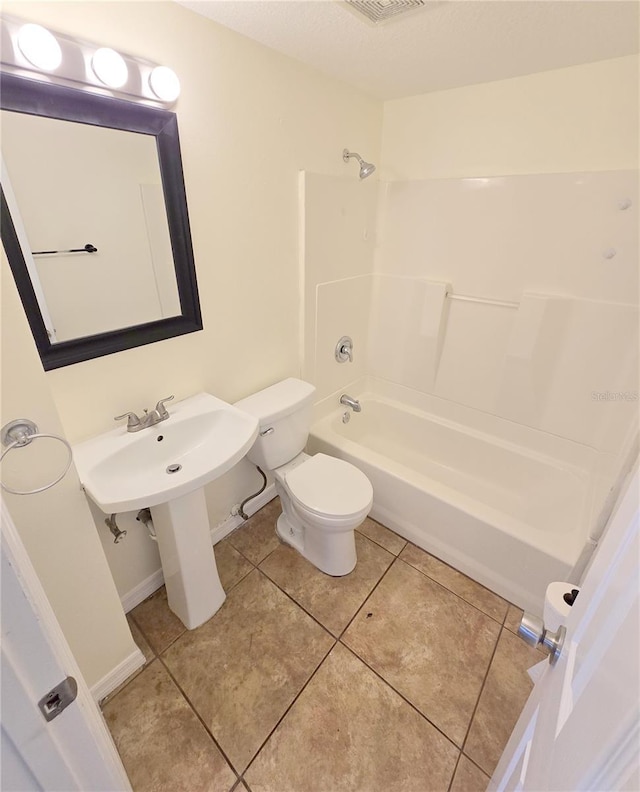 full bath with tile patterned floors, visible vents, shower / bath combination, toilet, and baseboards