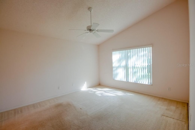 spare room with high vaulted ceiling, carpet flooring, ceiling fan, and a textured ceiling