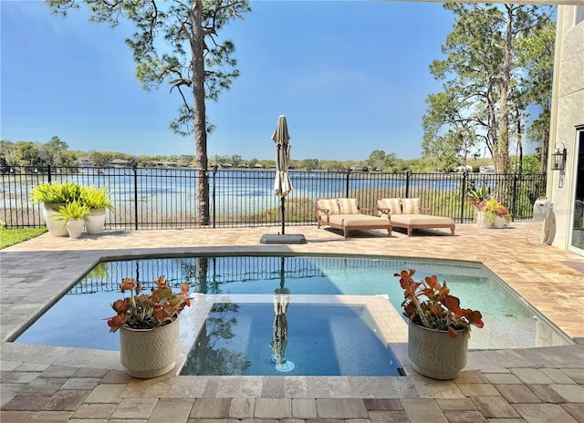 view of pool featuring a fenced in pool, a patio, a water view, and fence