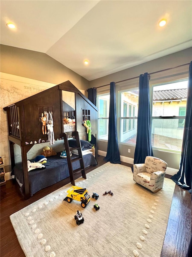 bedroom featuring vaulted ceiling, recessed lighting, wood finished floors, and baseboards