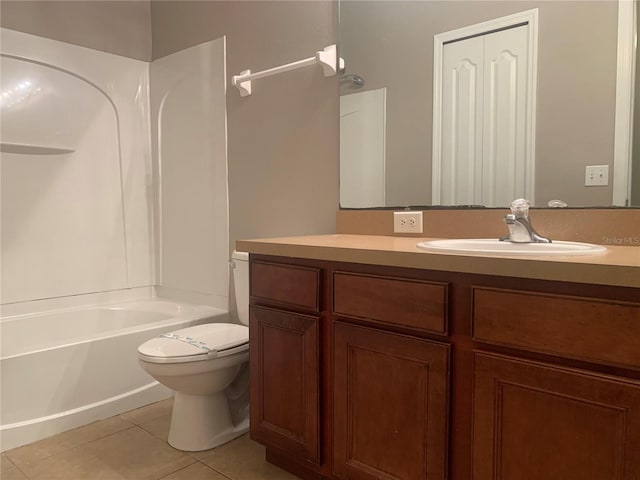 bathroom with tile patterned flooring, shower / tub combination, toilet, and vanity