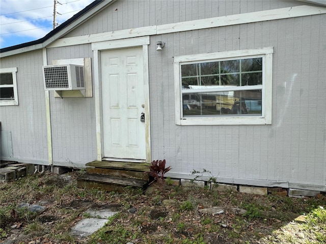 entrance to property featuring a wall mounted air conditioner