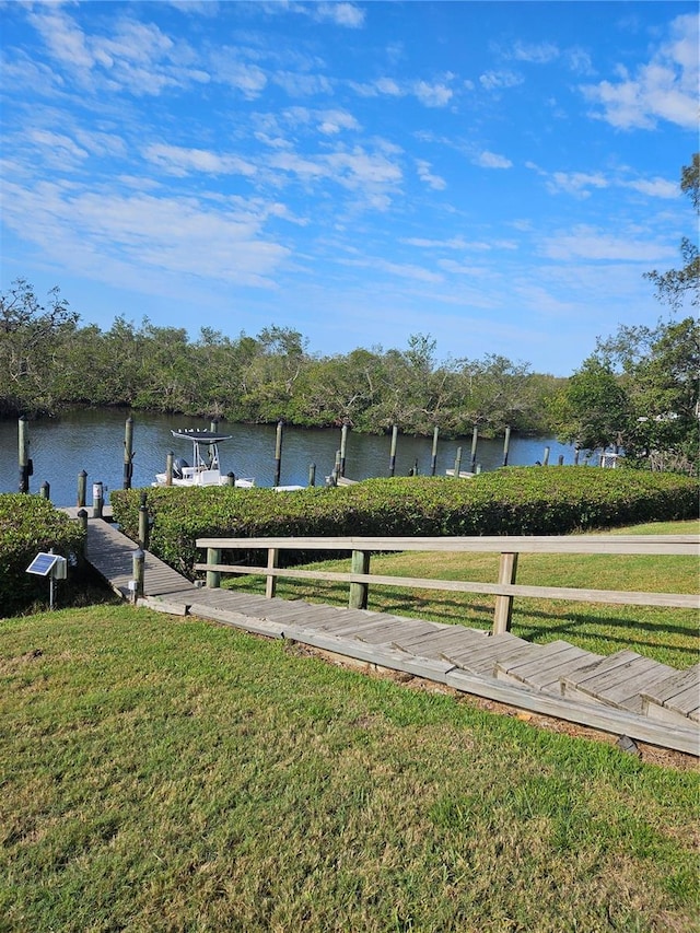 8744 54th Ave W Unit 8744, Bradenton, FL 34210 - dock area with a lawn and a water view
