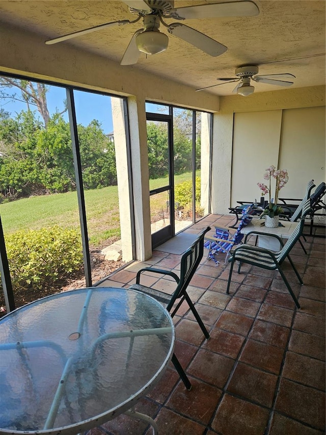 8744 54th Ave W Unit 8744, Bradenton, FL 34210 - sunroom with ceiling fan and outdoor dining space