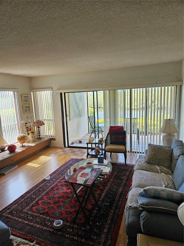 8744 54th Ave W Unit 8744, Bradenton, FL 34210 - living room with a textured ceiling and wood finished floors