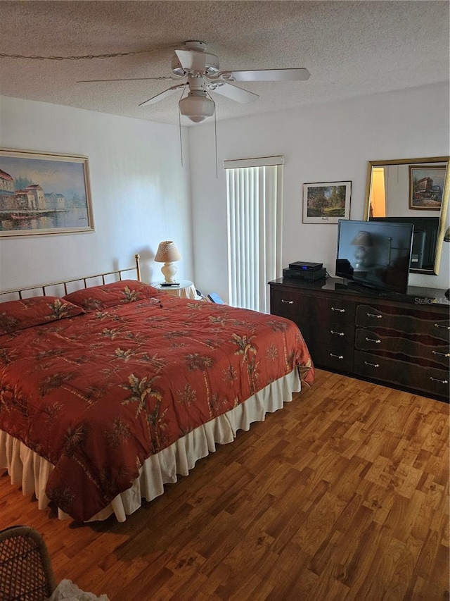 8744 54th Ave W Unit 8744, Bradenton, FL 34210 - bedroom with light wood-style floors, a textured ceiling, and ceiling fan