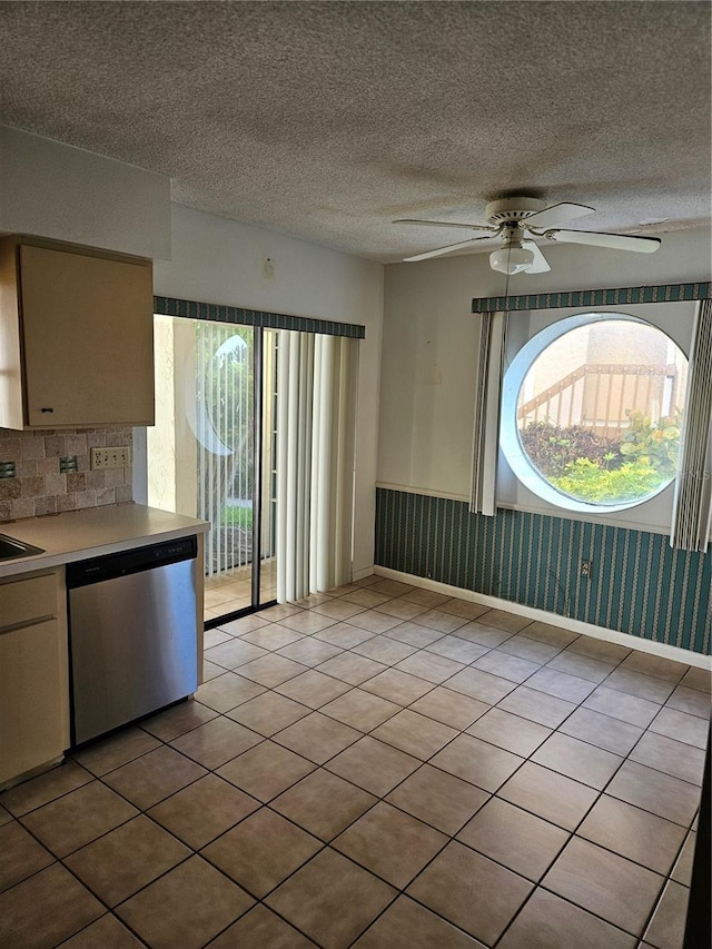 8744 54th Ave W Unit 8744, Bradenton, FL 34210 - kitchen featuring dishwasher, ceiling fan, wainscoting, light tile patterned floors, and light countertops