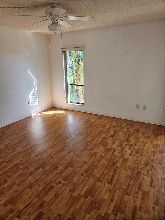 8744 54th Ave W Unit 8744, Bradenton, FL 34210 - unfurnished room featuring wood finished floors, a ceiling fan, baseboards, and a textured ceiling