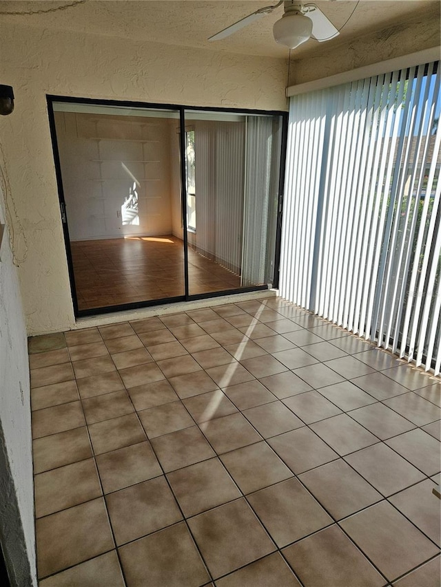 8744 54th Ave W Unit 8744, Bradenton, FL 34210 - unfurnished room with a textured wall, a ceiling fan, and tile patterned floors