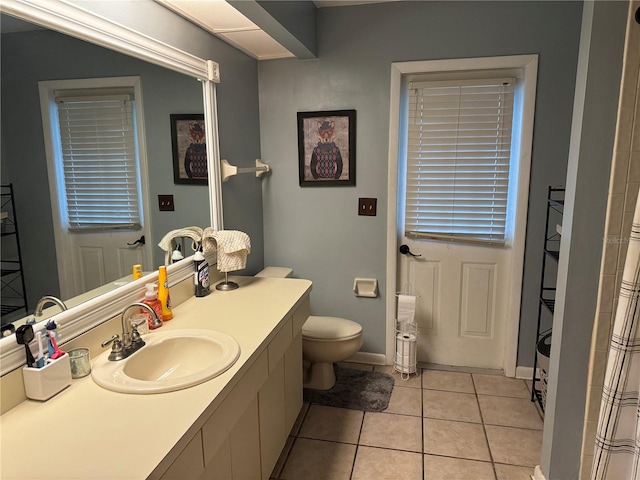 full bath featuring vanity, tile patterned floors, and toilet