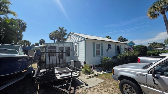 view of side of property with central AC unit