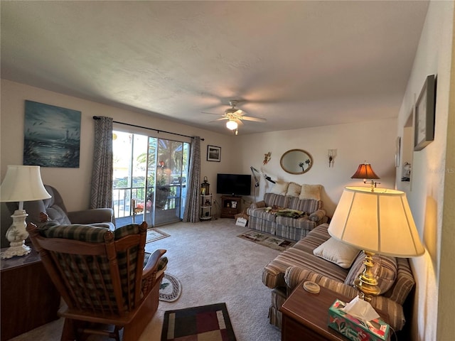 carpeted living room featuring ceiling fan