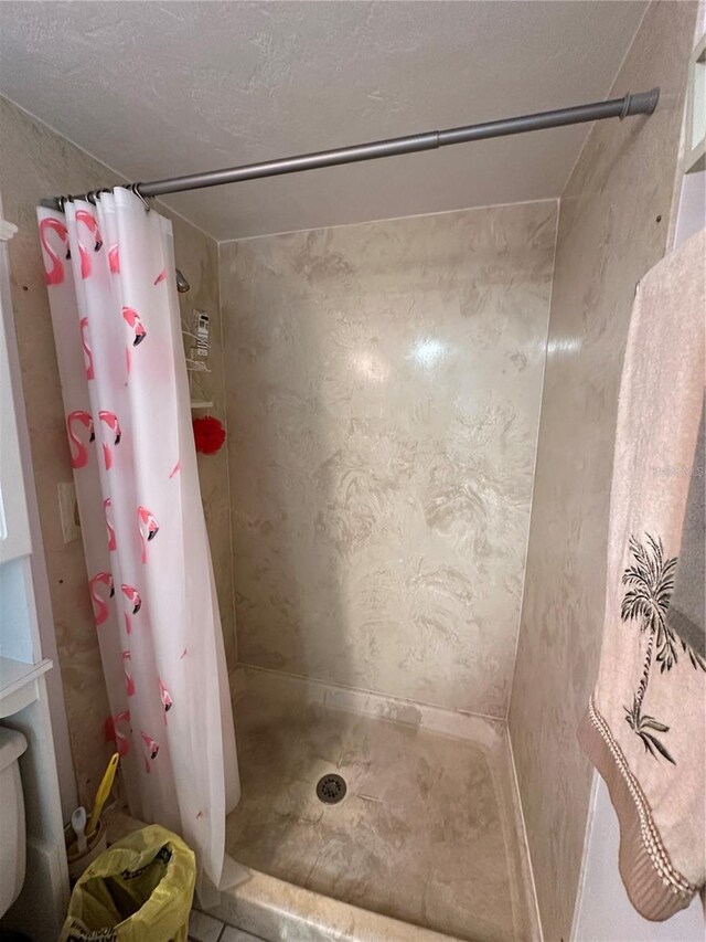 full bathroom with a shower stall