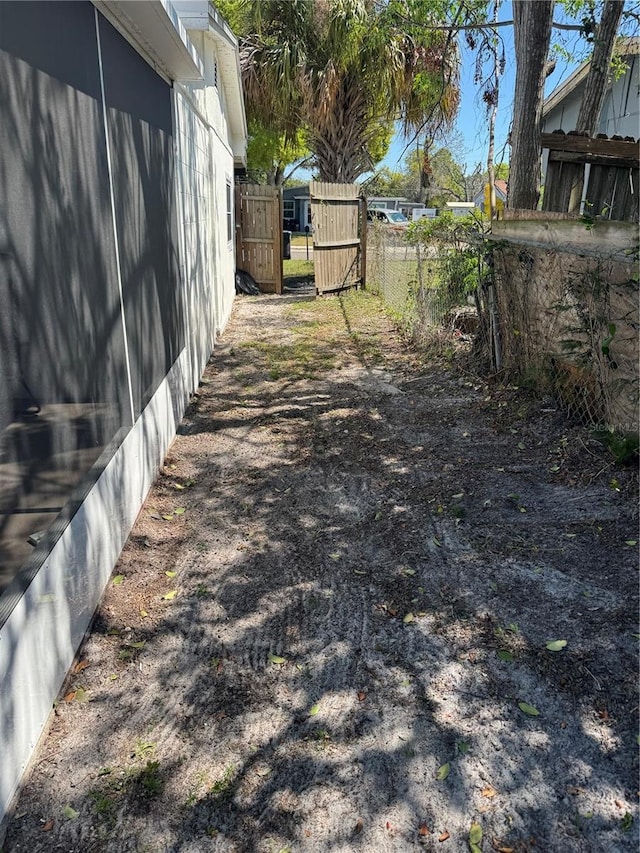 view of yard with a gate and fence