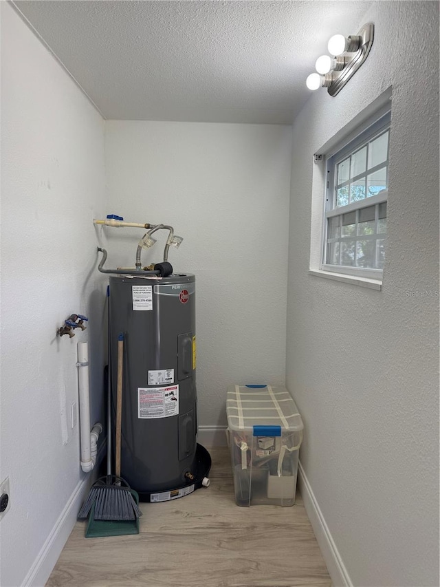 utility room featuring water heater