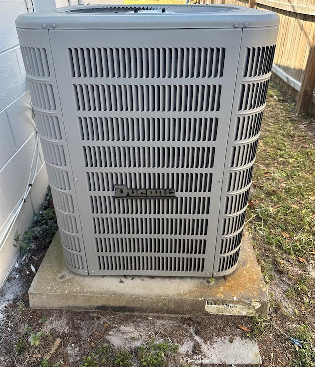 details with central air condition unit and fence