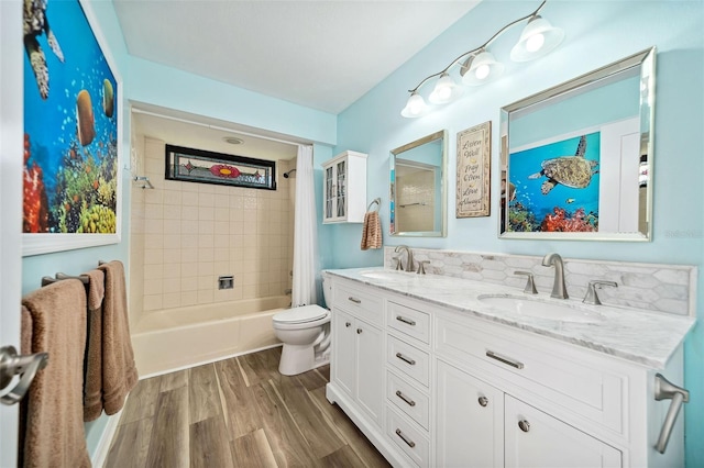 365 N Spaulding Cv, Lake Mary, FL 32746 - bathroom featuring toilet, wood finished floors, double vanity, and bathtub / shower combination