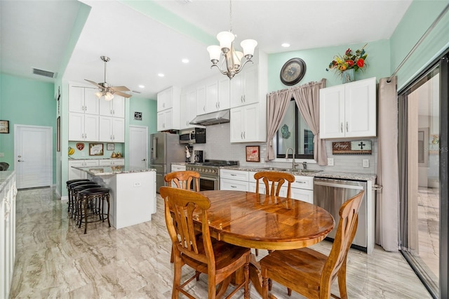 365 N Spaulding Cv, Lake Mary, FL 32746 - dining area featuring a ceiling fan, a chandelier, and recessed lighting
