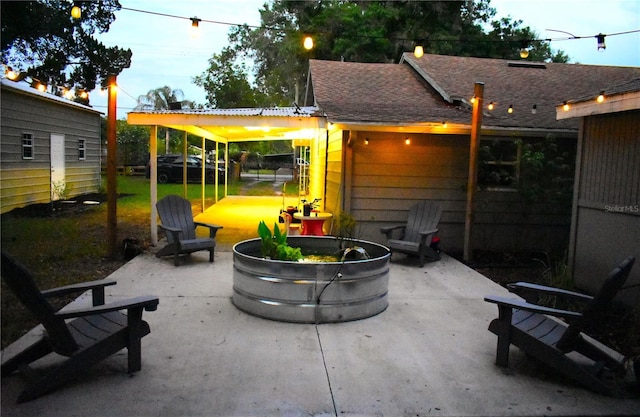 view of patio / terrace featuring an outdoor fire pit