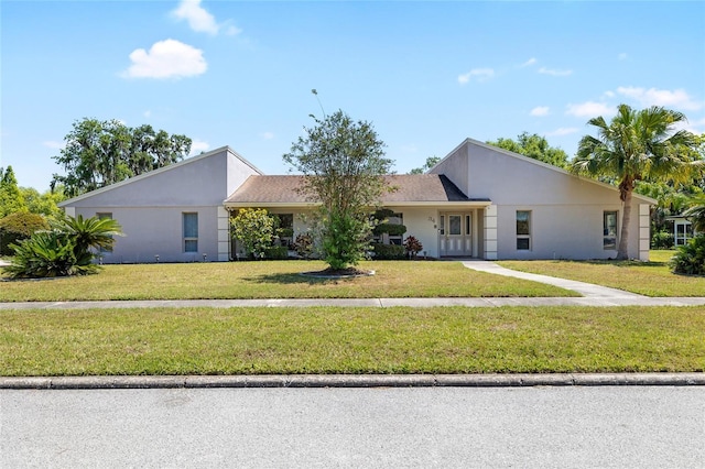 34 Misty Meadow Ln, Mulberry, FL 33860 - view of front of house with a front lawn and stucco siding