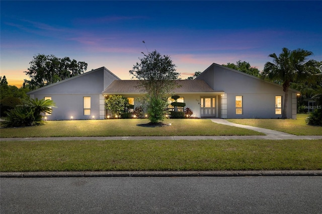 34 Misty Meadow Ln, Mulberry, FL 33860 - view of front facade with a front lawn and stucco siding