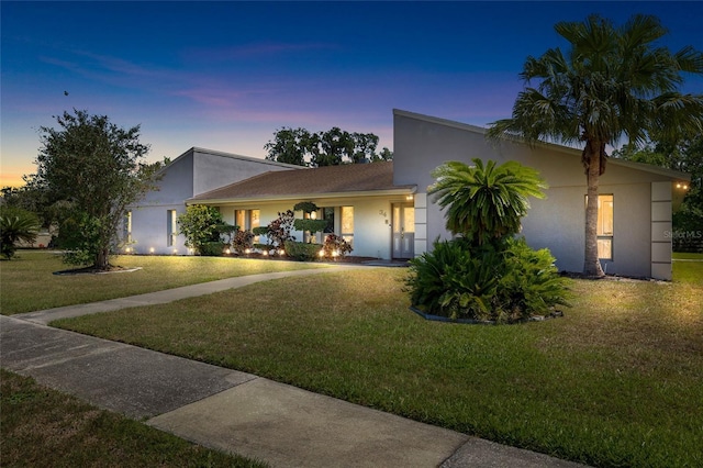 34 Misty Meadow Ln, Mulberry, FL 33860 - view of front facade with stucco siding and a front lawn