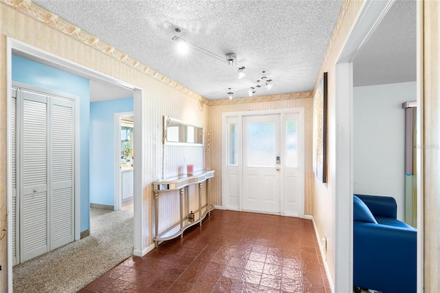 34 Misty Meadow Ln, Mulberry, FL 33860 - entryway with baseboards and a textured ceiling
