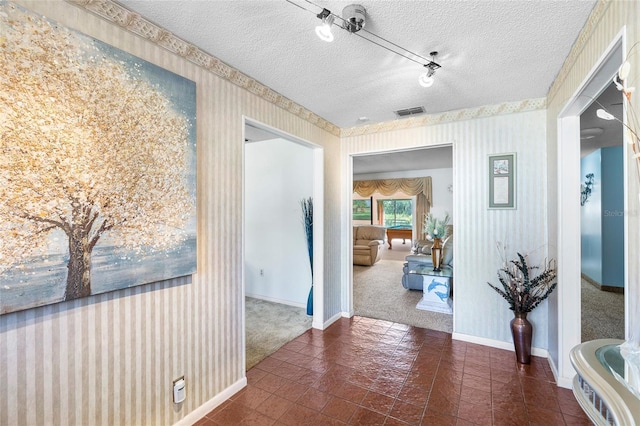 34 Misty Meadow Ln, Mulberry, FL 33860 - corridor with visible vents, baseboards, a textured ceiling, wallpapered walls, and carpet flooring