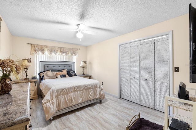 34 Misty Meadow Ln, Mulberry, FL 33860 - bedroom featuring a closet, baseboards, a ceiling fan, and a textured ceiling