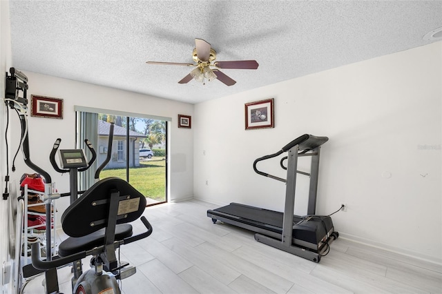34 Misty Meadow Ln, Mulberry, FL 33860 - workout area with light wood-style floors, ceiling fan, baseboards, and a textured ceiling