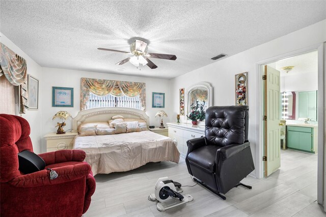 34 Misty Meadow Ln, Mulberry, FL 33860 - bedroom with a sink, visible vents, ceiling fan, and a textured ceiling