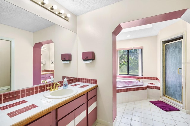 34 Misty Meadow Ln, Mulberry, FL 33860 - bathroom featuring vanity, a textured ceiling, a bath, and a stall shower